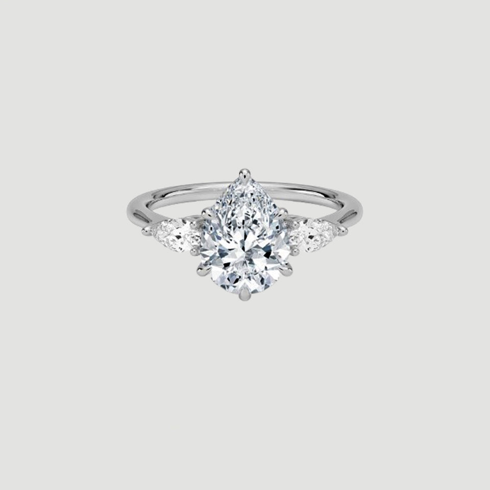 Moissanite Pear Three Stone Ring