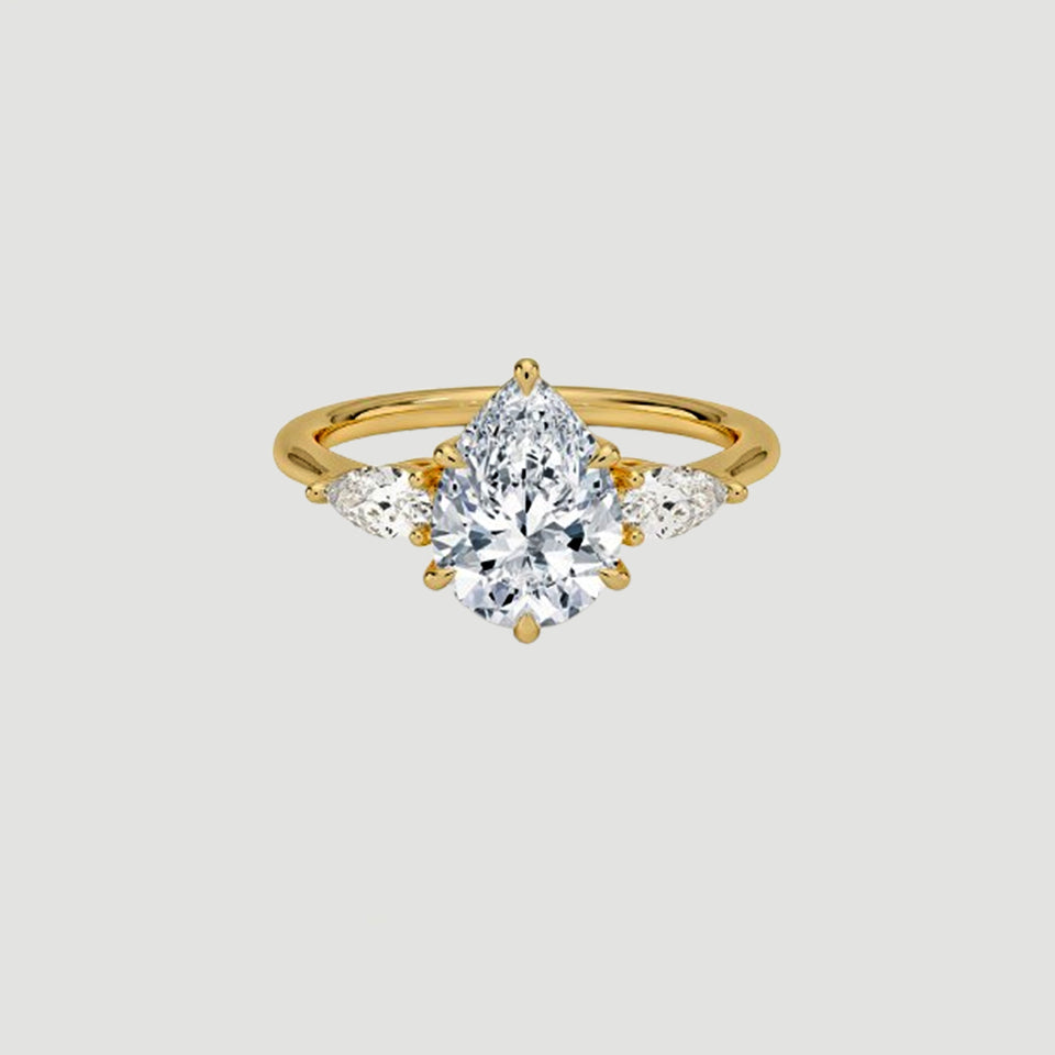 Moissanite Pear Three Stone Ring