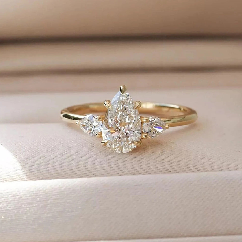 Moissanite Pear Three Stone Ring